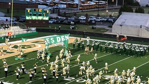 The Buford High School football team breaks through the banner to start its game with Chaminade, Fla. Buford lost 7-0 on Sept. 17, 2021.