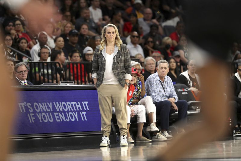 Las Vegas Aces coach Becky Hammon watches play during the first half of the team's WNBA basketball game against the Seattle Storm on Wednesday, June 19, 2024, in Las Vegas. (Steve Marcus/Las Vegas Sun via AP)