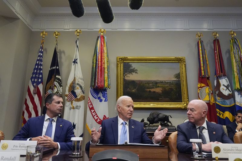 President Joe Biden speaks during a briefing on the government's response to Hurricane Helene in the Roosevelt Room of the White House in Washington, Tuesday, Oct. 1, 2024, as Secretary of Transportation Pete Buttigieg, left, and Secretary of Homeland Security Alejandro Mayorkas, right, look on. (AP Photo/Mark Schiefelbein)