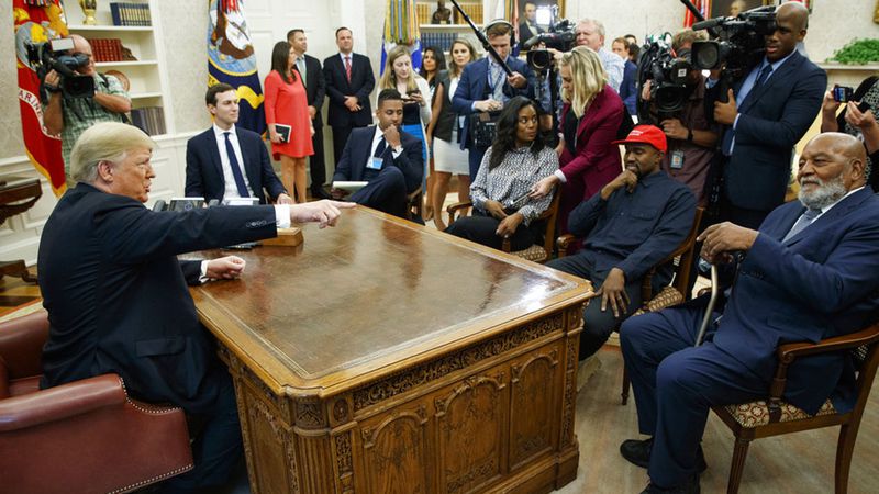 President Donald Trump meets with rapper Kanye West and former football player Jim Brown in the Oval Office of the White House, Thursday, Oct. 11, 2018, in Washington.