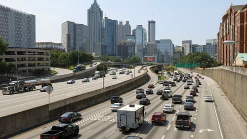 Automobiles travel south on the I-85 / I-75 connector from the view of the North Avenue bridge, Thursday, May 25, 2023, in Atlanta. (Jason Getz / Jason.Getz@ajc.com)