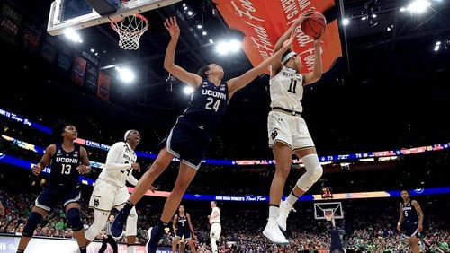 TAMPA, FLORIDA - APRIL 05:  Brianna Turner #11 of the Notre Dame Fighting Irish grabs the rebound from Napheesa Collier #24 of the UConn Huskies during the fourth quarter in the semifinals of the 2019 NCAA Women's Final Four at Amalie Arena on April 05, 2019 in Tampa, Florida. (Photo by Mike Ehrmann/Getty Images)