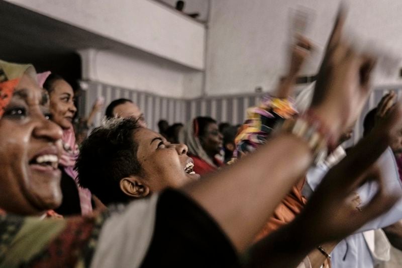 Sudanese refugees sitting in the audience cry as they watch Camirata troupe traditional show at the Russian culture center in Cairo, Egypt, Sunday, Sept. 15, 2024. (AP Photo/Amr Nabil)