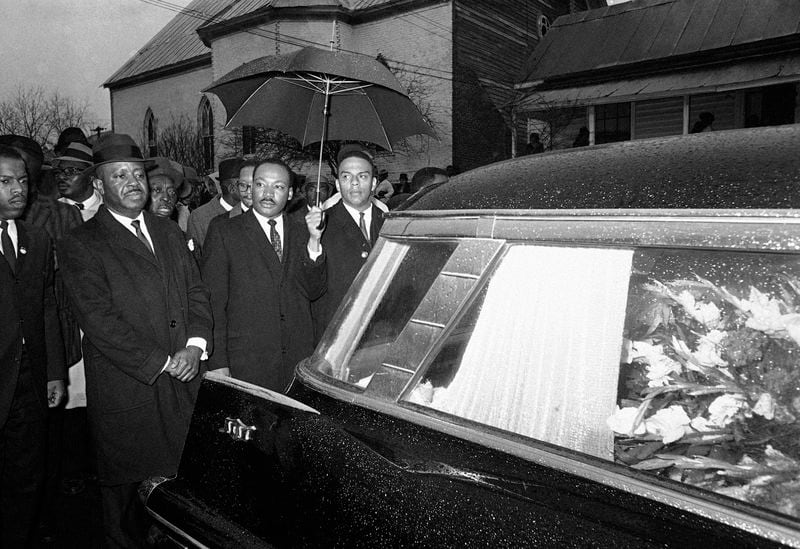 The Rev. Martin Luther King Jr. leads a procession behind the casket of Jimmie Lee Jackson. From left are John Lewis, the Rev. Ralph Abernathy, King and the Rev. Andrew Young. 