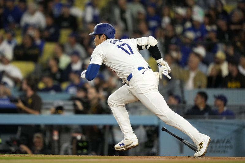 Los Angeles Dodgers' Shohei Ohtani heads to first for a double during the first inning of a baseball game against the San Diego Padres, Tuesday, Sept. 24, 2024, in Los Angeles. (AP Photo/Mark J. Terrill)