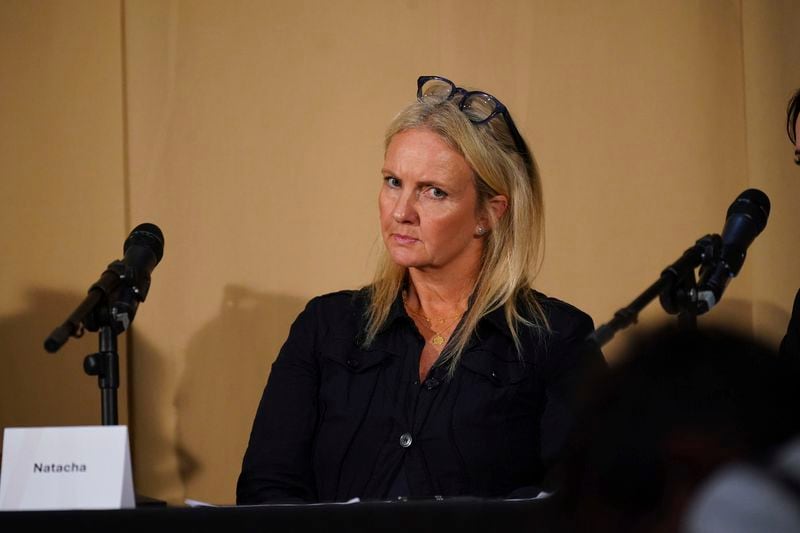 One of Mr Al Fayed's accusers, Natacha (no surname given), who featured in 'Al-Fayed: Predator at Harrods', looks on during a press conference to discuss their involvement in the investigation and the legal claim against Harrods for failing to provide a safe system of work for their employees, at Kent House in Knightsbridge, London, Friday Sept. 20, 2024. Multiple ex-Harrods employees have accused Mohamed Al Fayed, the Egyptian billionaire who owned the luxury department store for more than 25 years, of rape and sexual assault. (Yui Mok/PA via AP)