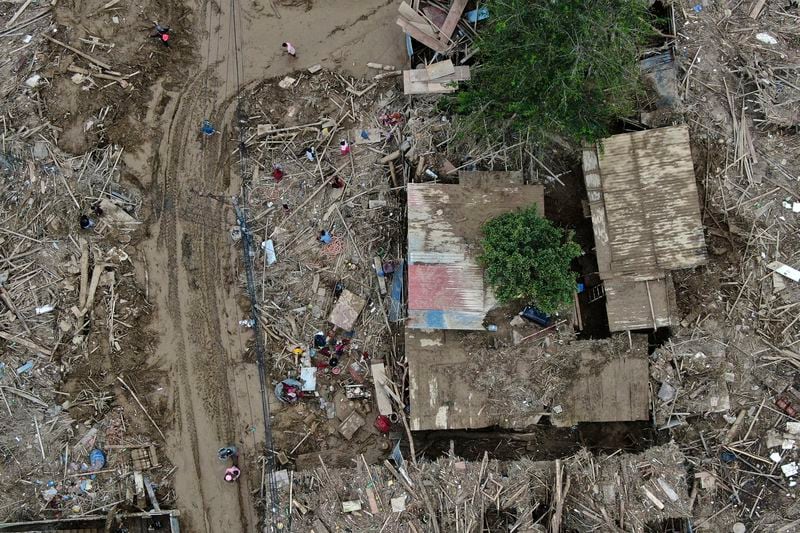 In this aerial image of the Kathmandu valley, debris is seen in Kathmandu, Nepal, Monday, Sept. 30, 2024 in the aftermath of a flood caused by heavy rains. (AP Photo/Gopen Rai)