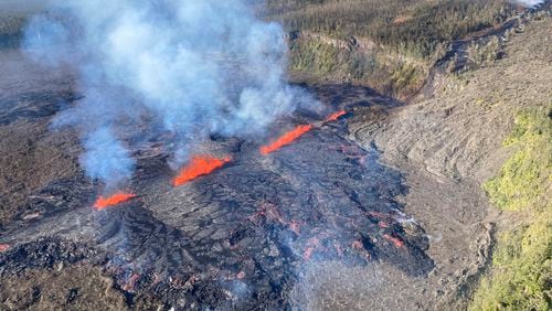 This photo provided by the U.S. Geological Survey, captured during a Hawaiian Volcano Observatory helicopter flyover Tuesday, Sept. 17, 2024, shows the eruption in Kilauea's middle East Rift Zone in Hawaii Volcanoes National Park, Hawaii. (A. Ellis/U.S. Geological Survey via AP)