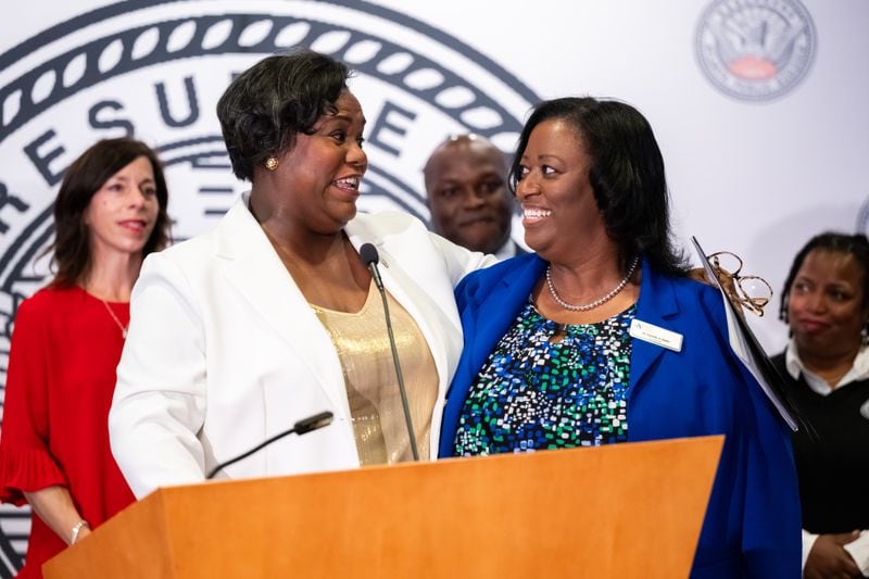 Atlanta Public Schools Board of Education Chair Erika Mitchell expresses gratitude to interim Superintendent Danielle Battle after announcing the sole finalist for APS superintendent, Bryan Johnson (seen at center, behind them), at a press conference at APS headquarters in downtown Atlanta on Tuesday, June 18, 2024. 
(Bita Honarvar for The Atlanta Journal-Constitution)