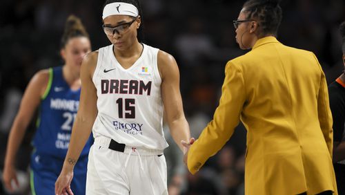 Atlanta Dream guard Allisha Gray (15) is consoled by head coach Tanisha Wright after Gray missed a three-point basket during the second half against the Minnesota Lynx at the Gateway Center Arena, Tuesday, Sept. 10, 2024, in Atlanta. The Dream lost 76-64 to the Lynx. (Jason Getz / AJC)

