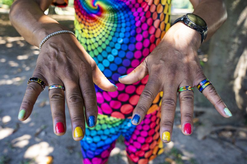 Michael Hills displays his colorful nail polish at the Pure Heat Community Festival in Piedmont Park on Sunday, Sept. 1, 2024.  (Olivia Bowdoin for the AJC).(Olivia Bowdoin for the AJC). 