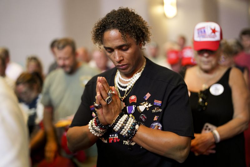 An attendee bows his head ahead of a speech Tuesday, Sept. 24, 2024, in Savannah by former President Donald Trump, the Republican presidential nominee, on economic policy. (Doug Mills/New York Times) 