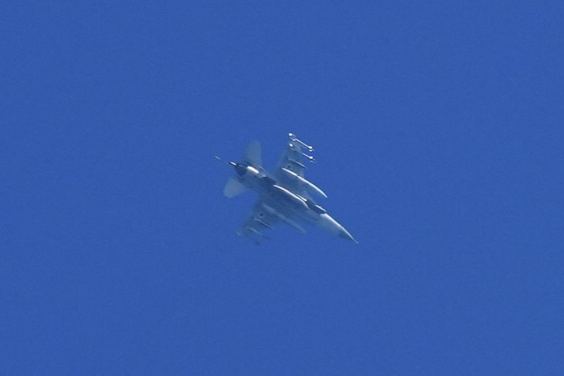 An armed Israeli fighter jet is seen from Haifa, northern Israel, on Monday, Sept. 23, 2024. (AP Photo/Baz Ratner)