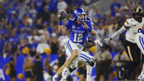 Kentucky Wildcats quarterback Brock Vandagriff (12) looks for a receiver while on the run in a game against the Southern Miss Eagles on August 31, 2024, at Kroger Field in Lexington, KY. (Photo by Jeff Moreland/Icon Sportswire) (Icon Sportswire via AP Images)