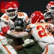 Atlanta Falcons running back Bijan Robinson (7) is tackled by Kansas City Chiefs defensive tackle Chris Jones (95) and Kansas City Chiefs linebacker Drue Tranquill (23) during the fourth quarter at Mercedes-Benz Stadium, Sunday, Sept. 22, 2024, in Atlanta. The Falcons lost 22-17. (Jason Getz / AJC)

