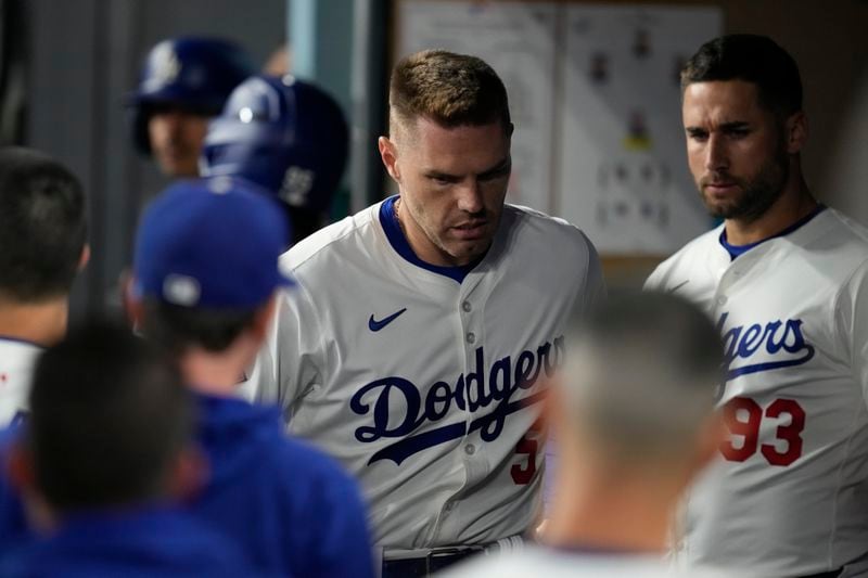 Los Angeles Dodgers' Freddie Freeman reacts in the dugout after an injury during the seventh inning of a baseball game against the San Diego Padres Thursday, Sept. 26, 2024, in Los Angeles. (AP Photo/Ashley Landis)