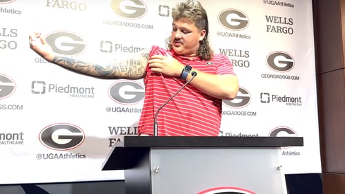 Georgia senior offensive guard Tate Ratledge describes each of the tattoos that adorn his right arm during the Bulldogs' preseason camp press conference at the Butts-Mehre Football Complex on Thursday, Aug. 1, 2024. (Photo by Chip Towers/ctowers@ajc.com)