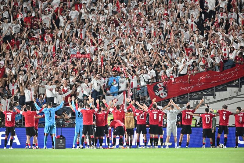 Georgia's players celebrate their 4-1 victory in the UEFA Nations League soccer match between Georgia and Czech Republic at the Mikheil Meskhi stadium in Tbilisi, Georgia, Saturday, Sept. 7, 2024. (AP Photo/Tamuna Kulumbegashvili)