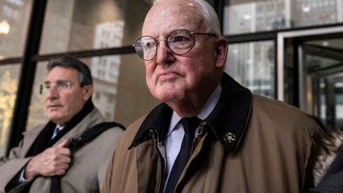 FILE - Flanked by family members and attorneys, former Ald. Edward Burke (14th) walks out of the Dirksen Federal Courthouse after being found guilty of racketeering, bribery and attempted extortion, Dec. 21, 2023, in Chicago. Burke, the longest-serving City Council member in Chicago history, was sentenced to two years in prison on Monday, June 24, 2024, far short of the eight-year term sought by federal prosecutors. (Ashlee Rezin/Chicago Sun-Times via AP, File)