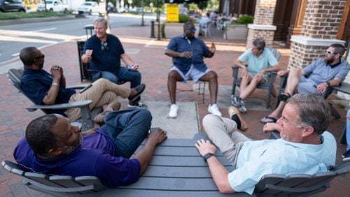 Kem Fleming (left) and George Scarborough talk during a meeting of the Bridge the Gap Christian Men’s Fellowship Group on Monday evening June 14, 2021, in Alpharetta.  (Ben Gray for The Atlanta Journal-Constitution)