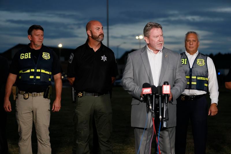 GBI Director Chris Hosey speaks to reporters outside Apalachee High School on Thursday night. Law enforcement officials arrested the father of school shooting suspect Colt Gray. 