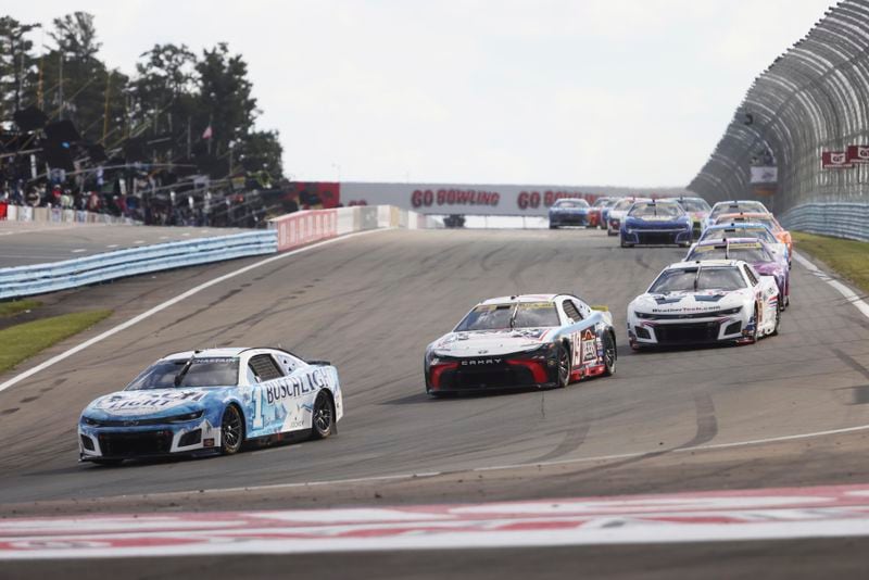 Ross Chasten (1) drives into Turn One during a NASCAR Cup Series auto race, Sunday, Sept. 15, 2024, in Watkins Glen, N.Y. (AP Photo/Lauren Petracca)