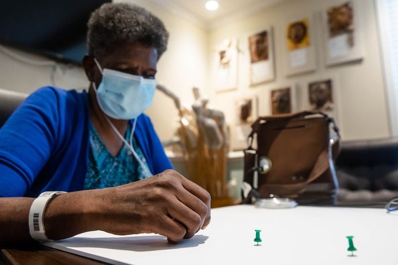 Lou Ellen Duncan uses push pins to help layout her expressive shape Tuesday afternoon at the Savannah Center for the Blind and Low Vision.