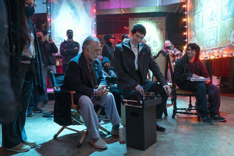 This image released by Lionsgate shows writer/director Francis Ford Coppola, left, and actor Adam Driver on the set of "Megalopolis." (Phil Caruso/Lionsgate via AP)