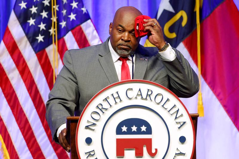 Lt. Gov. Mark Robinson wipes perspiration from his head as he speaks at the North Carolina GOP Convention in Greensboro, N.C., on Saturday, May 25, 2024. (Woody Marshall/News & Record via AP)