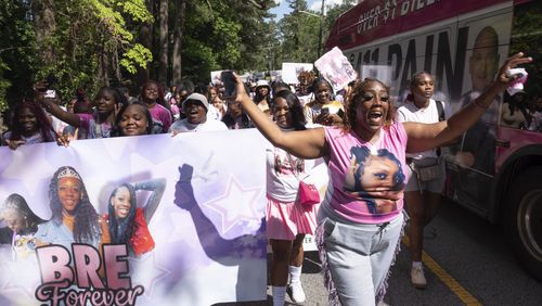 Necole Williams, mother of Bre’Asia Powell who was shot and killed a year ago, cheers during a “rally for peace” in Powell’s memory in Southwest Atlanta on Tuesday, May 28, 2024.   (Ben Gray / Ben@BenGray.com)