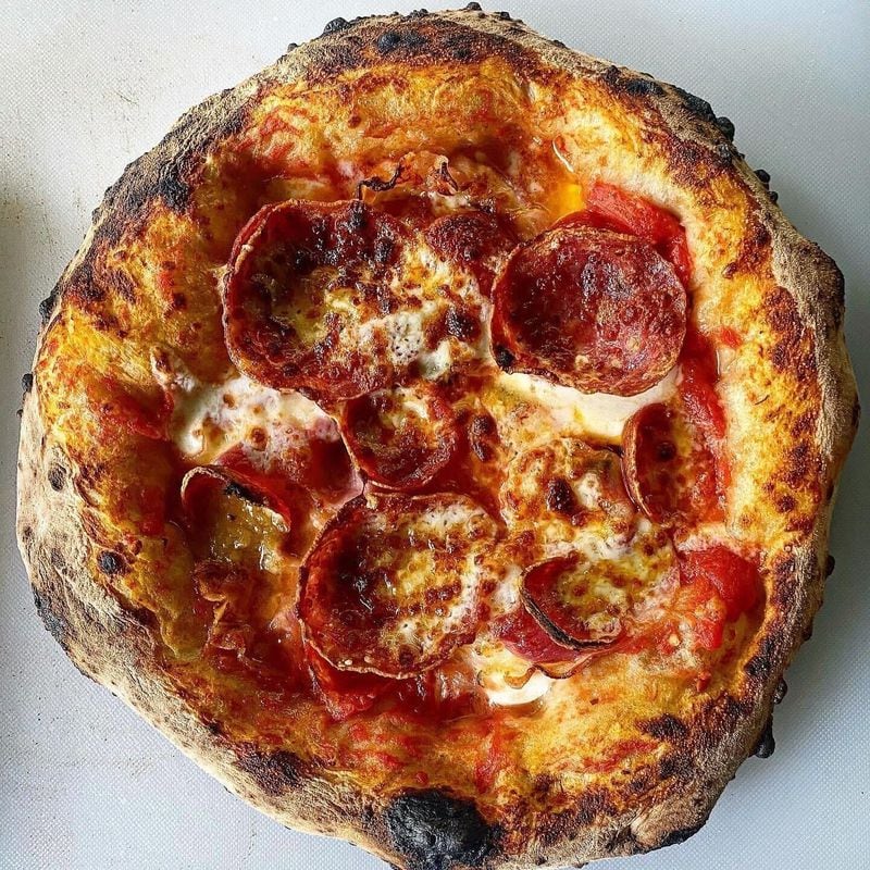 Ghost Pizza offers a variety of toppings for its 12-inch pizzas, including a classic pepperoni (pictured). / Courtesy of Ghost Pizza