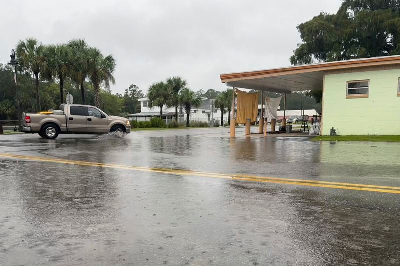 Water has begun to cover Riverside Drive in downtown St. Marks, Fla. on Thursday Sept 26, 2024. The town sits at the confluence of the Wakulla and St. Marks Rivers and is known to flood during storm events. (AP Photo/Kate Payne)