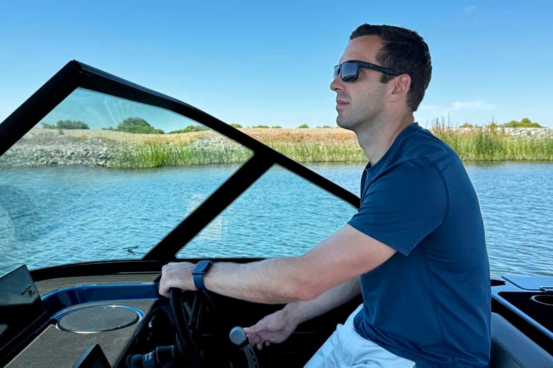 Mitch Lee, co-founder and CEO of Arc Boats, pilots an Arc Sport, an electric boat made by his California company, in the Sacramento-San Joaquin Delta near Bethel Island, Calif. on Wednesday, July 31, 2024. (AP Photo/Terry Chea)