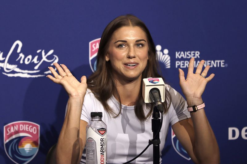 San Diego Waves FC's Alex Morgan smiles during a press conference announcing her retirement from professional soccer, Friday, Sept. 6, 2024, following Sunday's match against the North Carolina Courage. (John Gastaldo/The San Diego Union-Tribune via AP)