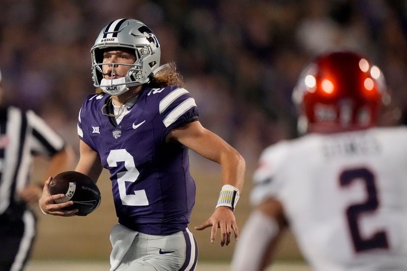 Kansas State quarterback Avery Johnson (2) runs the ball during the first half of an NCAA college football game against Arizona Friday, Sept. 13, 2024, in Manhattan, Kan. (AP Photo/Charlie Riedel)