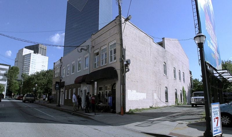 The building where Fiddlin’ John Carson recorded the first country music hit in 1923 still stands at 152 Nassau Street in downtown Atlanta, but developers of a Margaritaville-themed hotel, timeshare rental and restaurant acquired a permit earlier this month to demolish it. (Tyson Horne / Tyson.Horne@ajc.com)