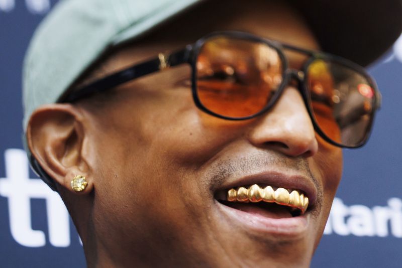 Pharrell Williams arrives on the red carpet for the premiere of 'Piece by Piece' at the Princess of Wales Theatre during the Toronto International Film Festival in Toronto, Tuesday, Sept. 10, 2024. (Cole Burston/The Canadian Press via AP)