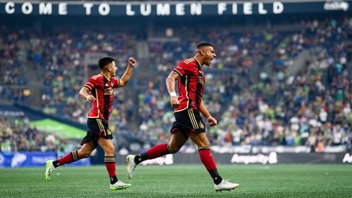 Atlanta United forward Giorgos Giakoumakis (right) celebrates with teammates after a goal during the first half of the match against Seattle Sounders FC at Lumen Field in Seattle on Sunday Aug. 20, 2023. (Photo by Mitch Martin/Atlanta United)
