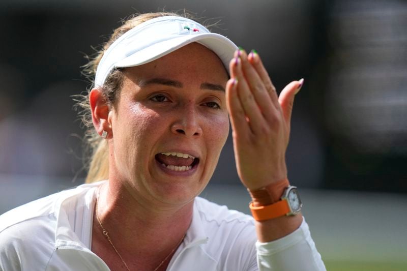 Donna Vekic of Croatia reacts after loosing a point against Jasmine Paolini of Italy during their semifinal match at the Wimbledon tennis championships in London, Thursday, July 11, 2024. (AP Photo/Mosa'ab Elshamy)