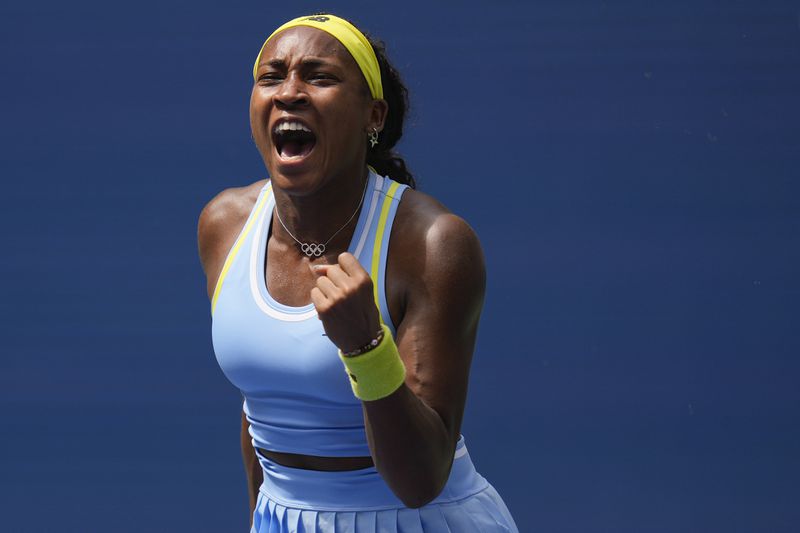 Coco Gauff, of the United States, reacts after scoring a point against Elina Svitolina, of Ukraine, during the third round of the U.S. Open tennis championships, Friday, Aug. 30, 2024, in New York. (AP Photo/Seth Wenig)