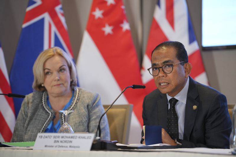 Malaysian Defense Minister Mohamed Khaled Nordin, right, speaks as New Zealand Defense Minister Judith Collins listens during a press conference for the Five Power Defence Arrangements Defence Ministers' Meeting on the sidelines of the Shangri-la Dialogue in Singapore Friday, May 31, 2024. (AP Photo/Vincent Thian)