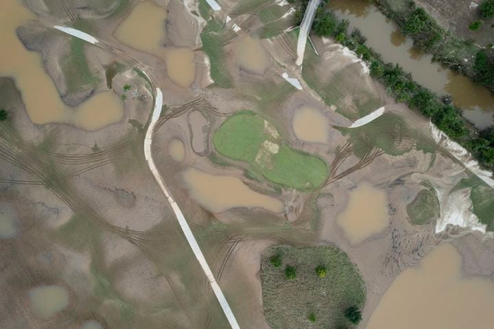 Mud and standing water cover much of the Bobby Jones Golf Course in Atlanta on Saturday, Sept. 28, 2024 after Peachtree Creek spilled its banks from Hurricane Helene.   Ben Gray for the Atlanta Journal-Constitution