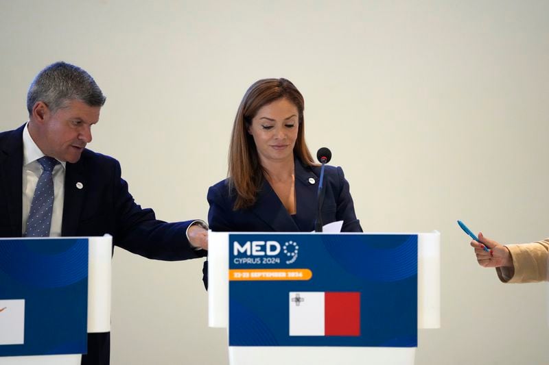 Cypriot Minister of Energy George Papanastasiou, left, talks with his Maltese counterpart Miriam Dalli, during a press conference after the MED9 Energy Ministerial Meeting in southern coastal city of Larnaca, Cyprus, Monday, Sept. 23, 2024. (AP Photo/Petros Karadjias)