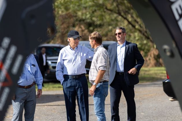 President Joe Biden greets farmer Buck Paulk (center) at his pecan farm in Ray City on Thursday, October 3, 2024, as the president surveys damage from Hurricane Helene. (Arvin Temkar / AJC)
