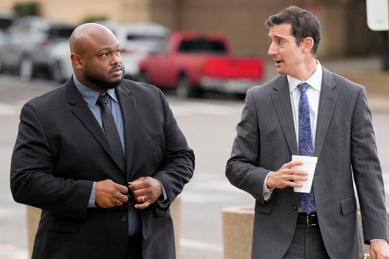 Former Memphis police officer Desmond Mills, left, arrives at the federal courthouse with his attorney Blake Ballin, right, to testify against his former colleagues during the trial in the Tyre Nichols case Wednesday, Sept. 25, 2024, in Memphis, Tenn. (AP Photo/George Walker IV)