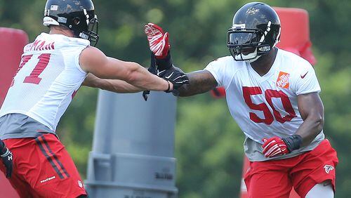 Falcons linebacker Brien Schofield works against Kroy Biermann, who was re-signed to a one-year deal, on a drill during team practice Wednesday, June 17, 2015, in Flowery Branch.