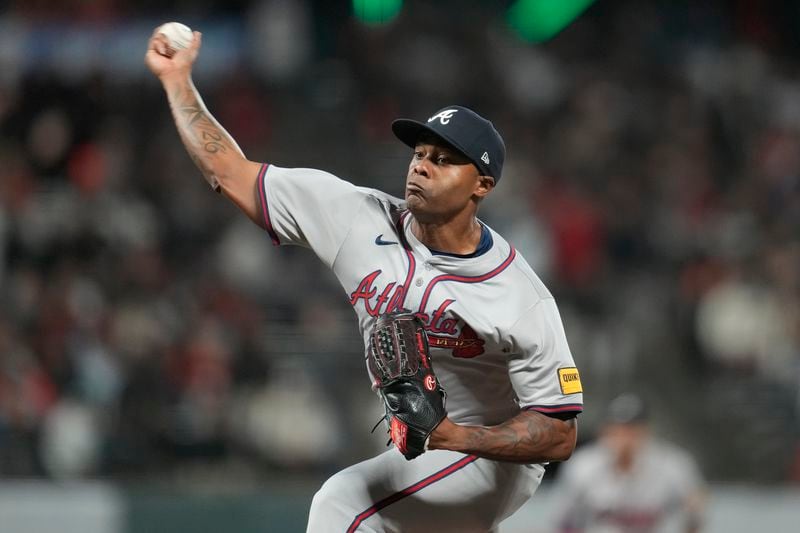 Atlanta Braves pitcher Raisel Iglesias works against the San Francisco Giants during the ninth inning of a baseball game in San Francisco, Monday, Aug. 12, 2024. (AP Photo/Jeff Chiu)