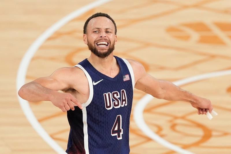 FILE - United States' Stephen Curry (4) reacts after winning a men's gold medal basketball game against France at Bercy Arena at the 2024 Summer Olympics, Aug. 10, 2024, in Paris, France. (AP Photo/Michael Conroy, File)