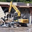 Heavy machinery is seen to demolish part of North Dekalb Mall, signifying the start of development for a new multi-use project on Wednesday, June 26, 2024.
(Miguel Martinez / AJC)