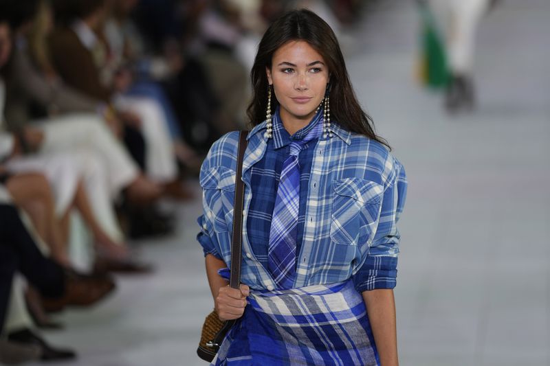 A model walks the runway during the Ralph Lauren Spring/Summer 2025 fashion show as part of New York Fashion Week on Thursday, Sept. 5, 2024, at Khalily Stables in Bridgehampton, N.Y. (Photo by Charles Sykes/Invision/AP)